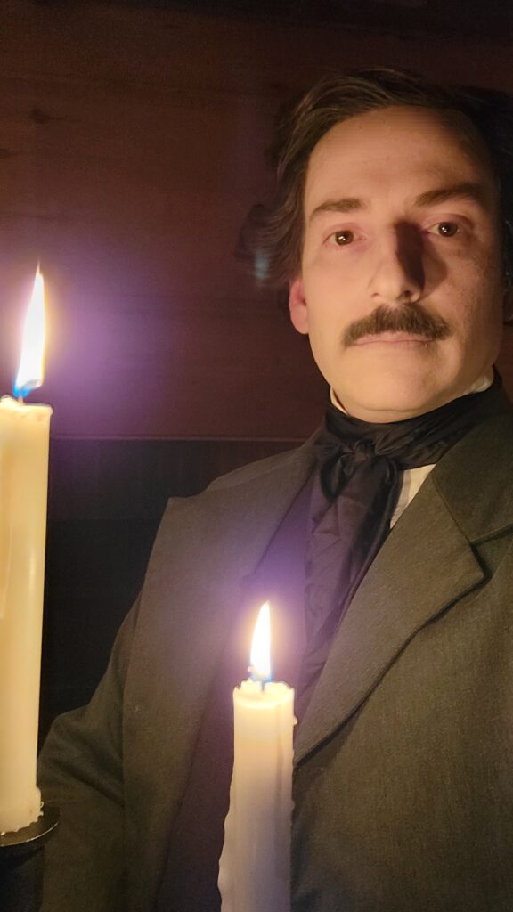 Campbell Harmon as Edgar Allan Poe with candles.