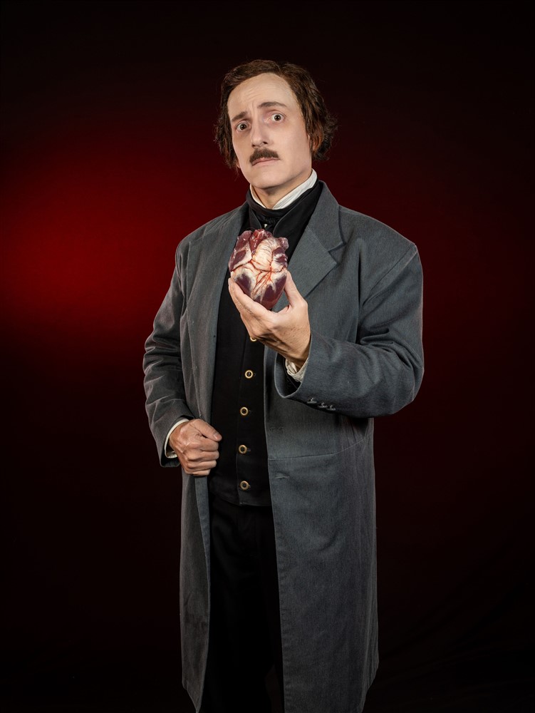 Campbell Harmon as Edgar Allan Poe holding a Tell-Tale Heart.